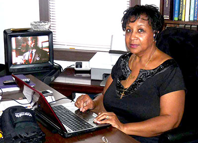 Rachel Ayers at her desk in Thrift Shop