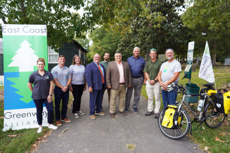 County representatives posing for a picture on the greenway