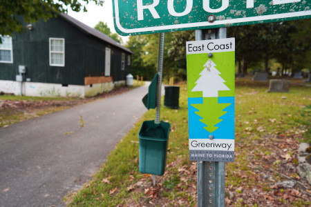 Picture of the new East Coast Greenway sign at the Bob Jaycee Park