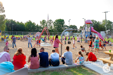 Large family event taking place on the playground