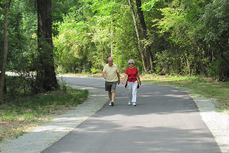 Senior citizens taking a morning walk along the greenway