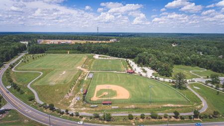 Drone footage of the park, facing north and capturing the ball fields and trails