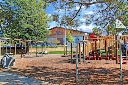 Playground at the park with Smithfield Recreation & Aquatic Center in the background