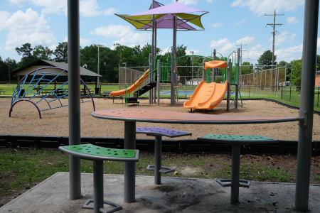 Picnic area with view of the playground and tennis courts at Smith Collins Park