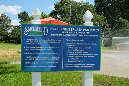 Contact and rules sign for Eva E. Ennis Splash Pad