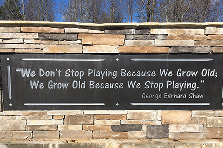 Sign at the park with quote by George Bernard Shaw