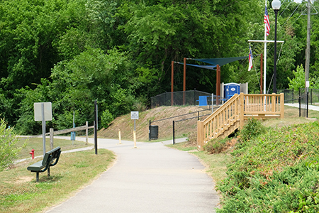 View of the Buffalo Creek Greenway entrance at the far end of the park