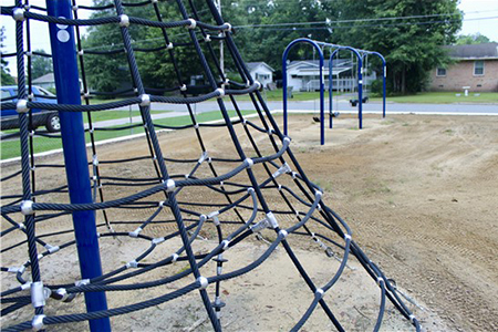 Swings and jungle gym on the playground site