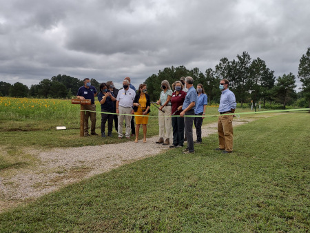 Officials cutting the ribbon for grand opening of Bailey and Sarah Williamson Nature Preserve
