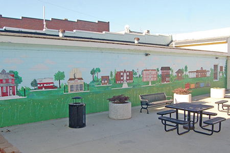 Mural of Selma's landmark structures and places of interest along courtyard wall