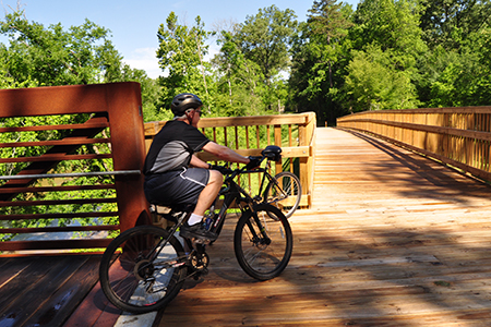 Biker beginning his cross of the bridge over the Neuse River